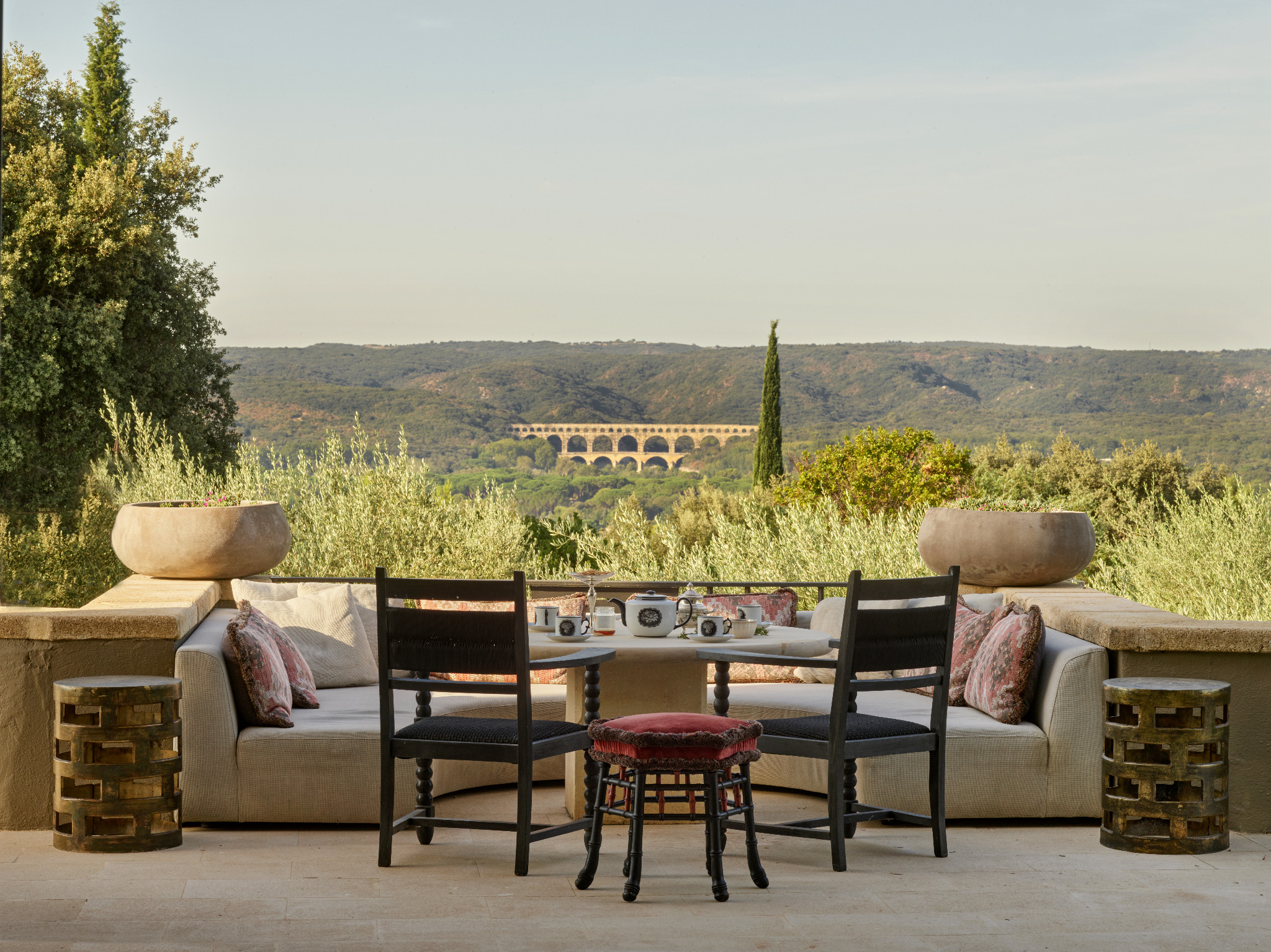Champagne overlooking the Pont du Gard at golden hour