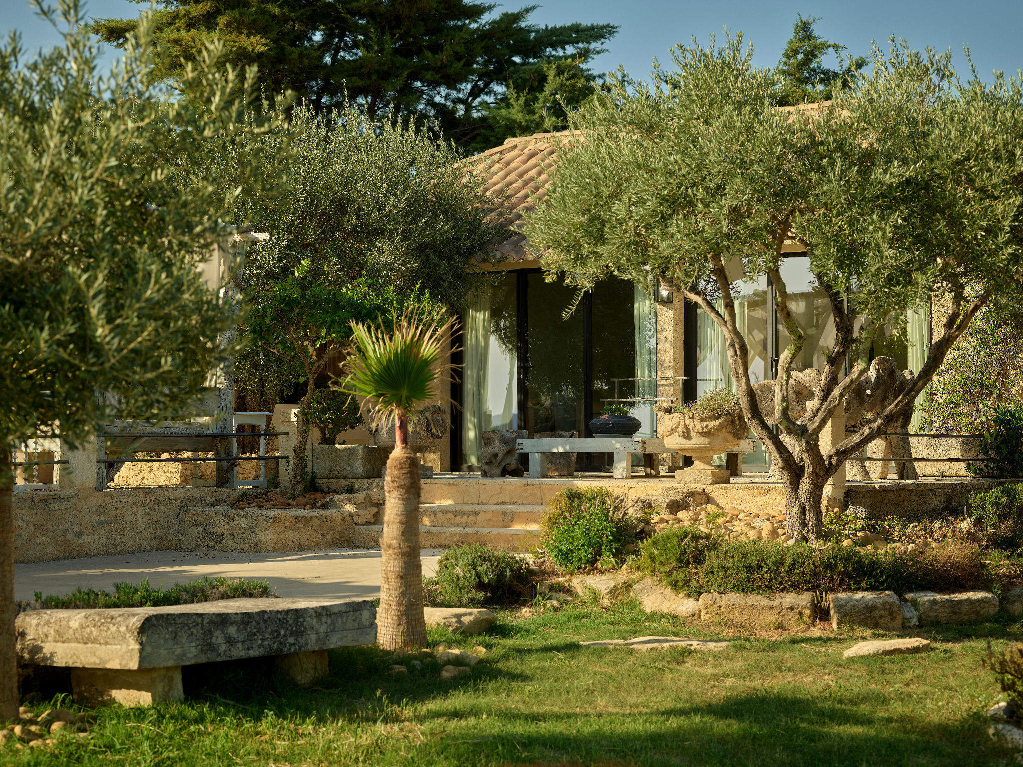 Two chairs overlooking the mill and garrigue